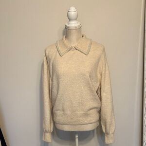 Elegant Cream Sweater with Embellished Collar